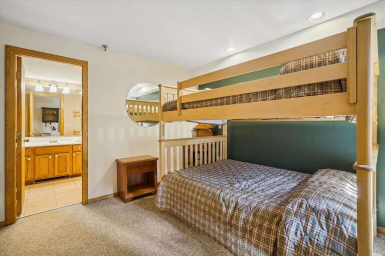 Modestly decorated queen/full bunk bed