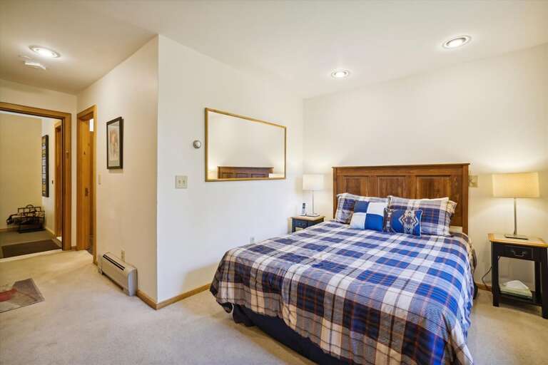 Queen bedroom w/ bathroom and deck access Queen bedroom w/ bathroom and deck access