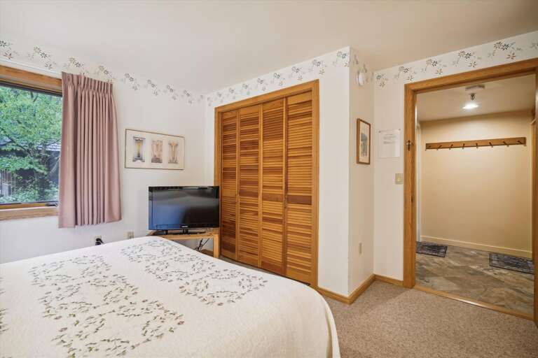 Bright and cheery queen bedroom.   Plenty of space and storage.