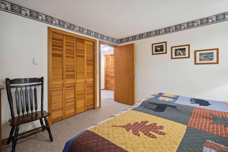 King bedroom tastefully represents Vermont's country setting