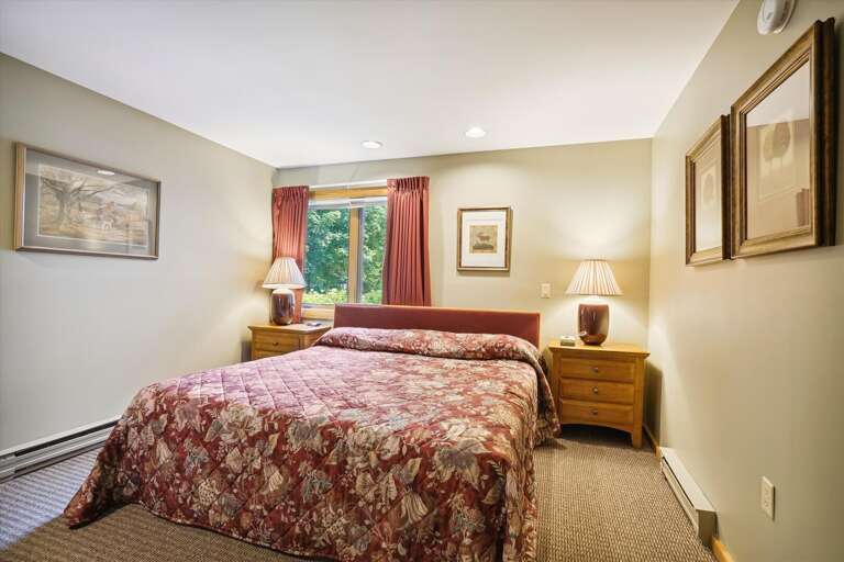 King bedroom has warm hues to take the chill off of the cold days in the winter and bring comfort and cheer during any season. Windows frame the beautiful scenery of Highridge.