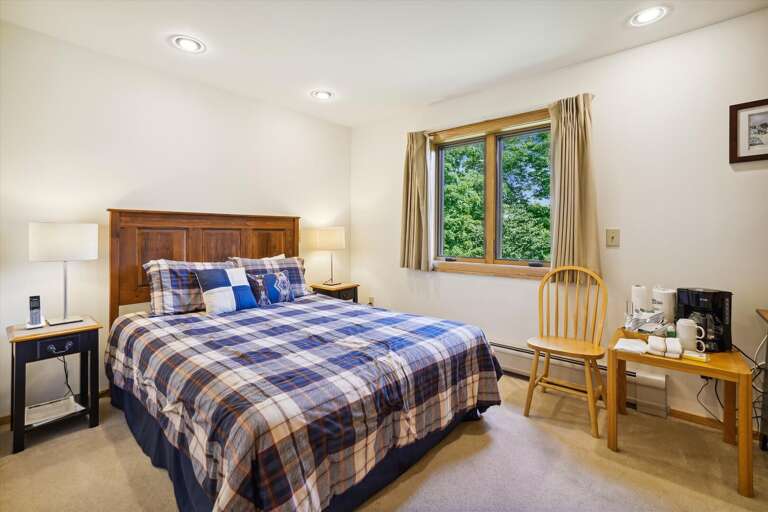 Queen sized bed, access to small deck.  Small amenities for your convenience, coffee pot and TV Queen sized bed, access to small deck.  Small amenities for your convenience, coffee pot and TV