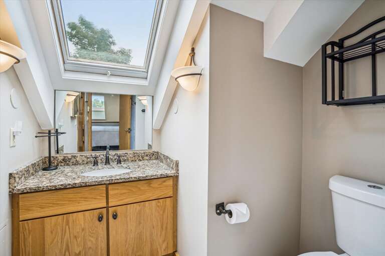 Full bathroom with shower located upstairs for the King bed in the loft. Sauna access, seating for 2