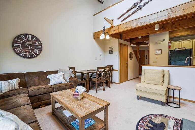 Spacious living room with lots of comfortable seating.   Easy access to dining room and kitchen.