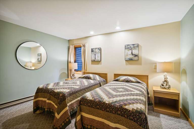 Enjoy the calming colors in the twin bedroom.
