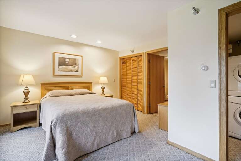 Spacious master bedroom located in lower level of the condo. Attached bathroom and your own Entrance/Exit to deck