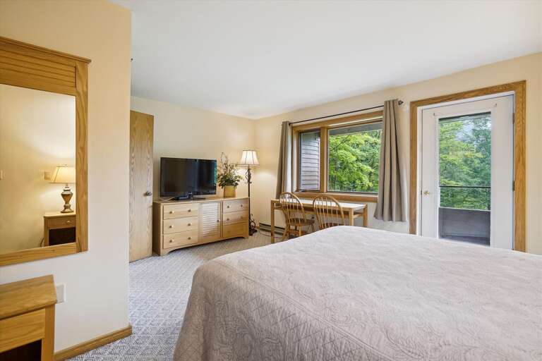Spacious master bedroom located in lower level of the condo. Attached bathroom and your own Entrance/Exit to deck Spacious master bedroom located in lower level of the condo. Attached bathroom and your own Entrance/Exit to deck