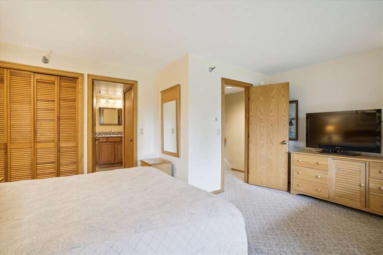 Spacious master bedroom located in lower level of the condo. Attached bathroom and your own Entrance/Exit to deck Spacious master bedroom located in lower level of the condo. Attached bathroom and your own Entrance/Exit to deck