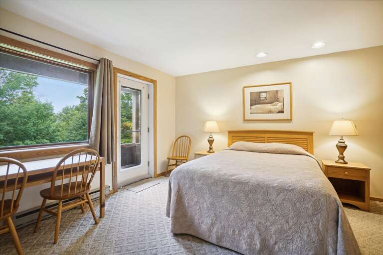 Spacious master bedroom located in lower level of the condo. Attached bathroom and your own Entrance/Exit to deck Spacious master bedroom located in lower level of the condo. Attached bathroom and your own Entrance/Exit to deck