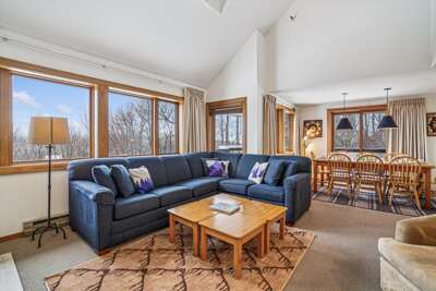 Sunlit Living Room with Wraparound Windows