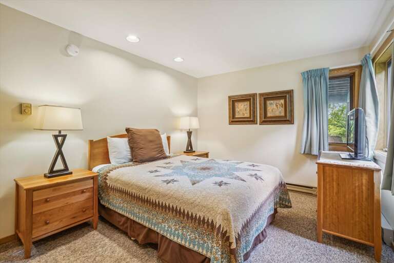 Tastefully decorated in country fashion, queen bedroom with attached bathroom.  Natural light filters through the windows which frame the natural scenery the scenery surrounding your unit. Tastefully decorated in country fashion, queen bedroom with attached bathroom.  Natural light filters through the windows which frame the natural scenery the scenery surrounding your unit.