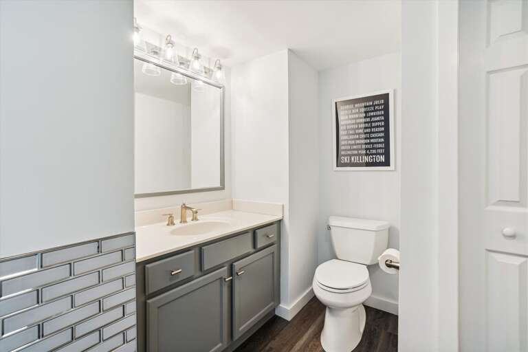 Well lit spacious bathroom.