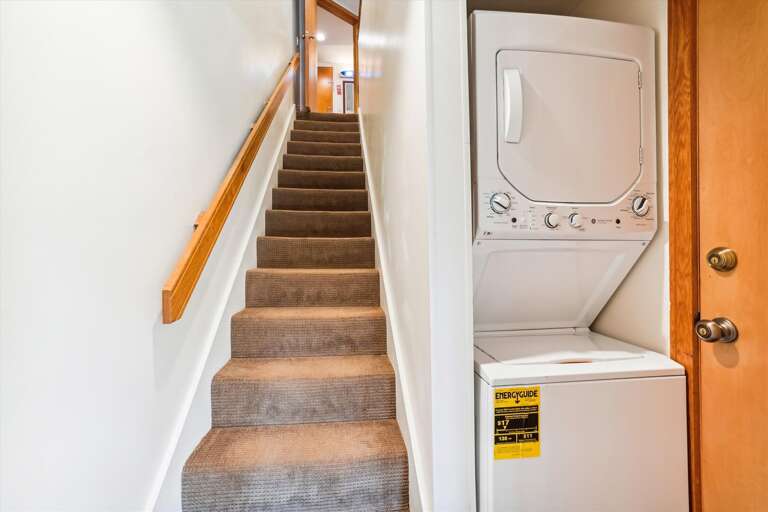 Stairway to the upper level. Washer and dryer for your use.