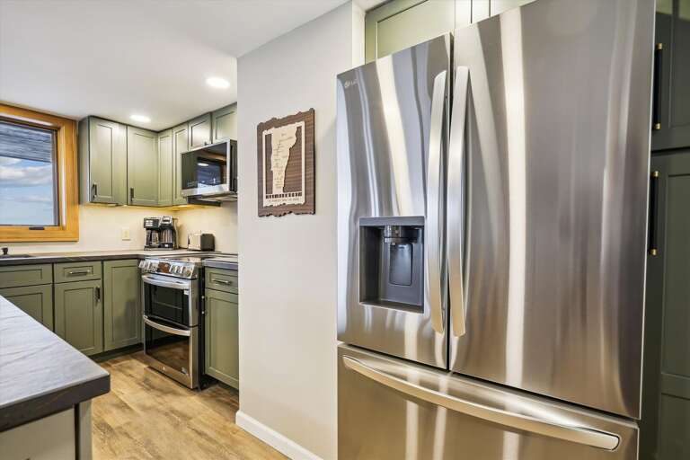 Beautifully upgraded kitchen just makes you want to be in it and cook!   Lots of counter space and great views of the mountain.  Open floor plan so all can enjoy.