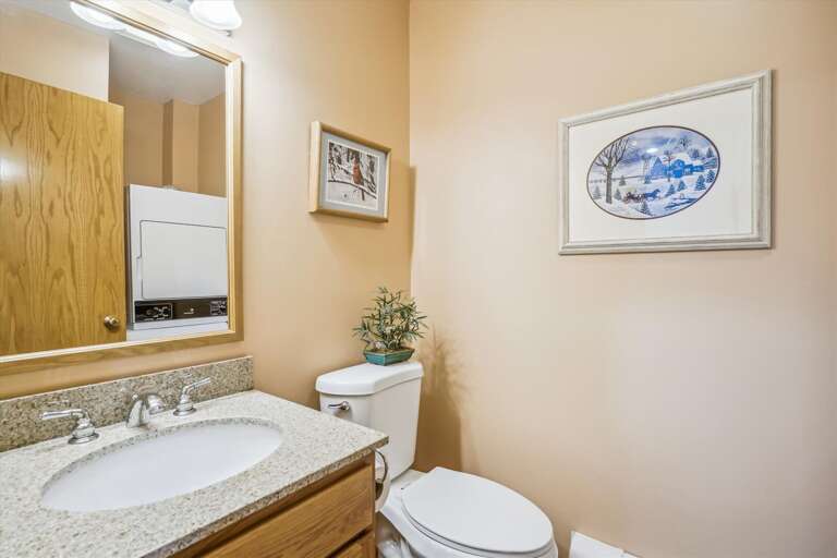 Bathroom with a washer and dryer.