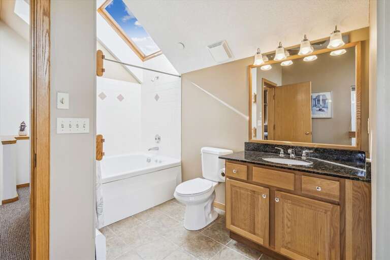 The skylight lights up the bathroom.