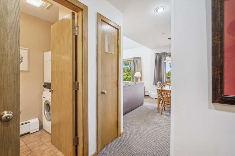 A view of the bathroom and living room.