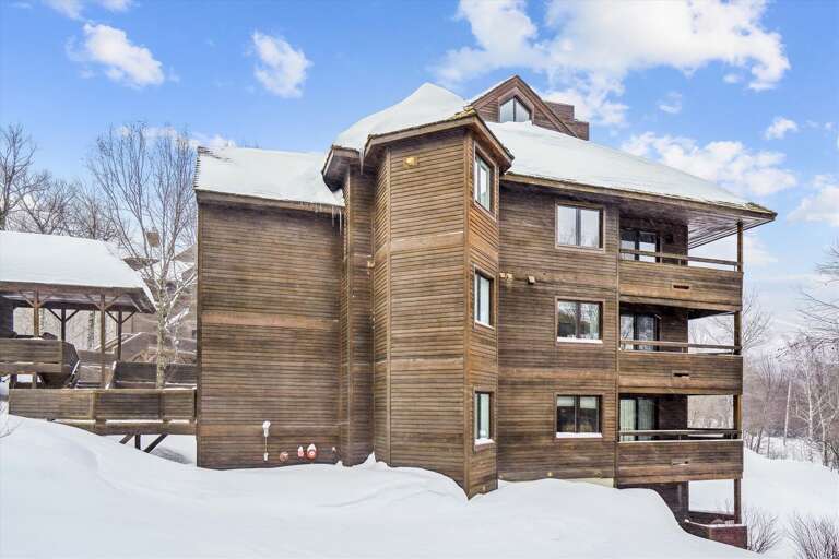 Wood-clad Vacation Rental Surrounded By Snowy Scenery
