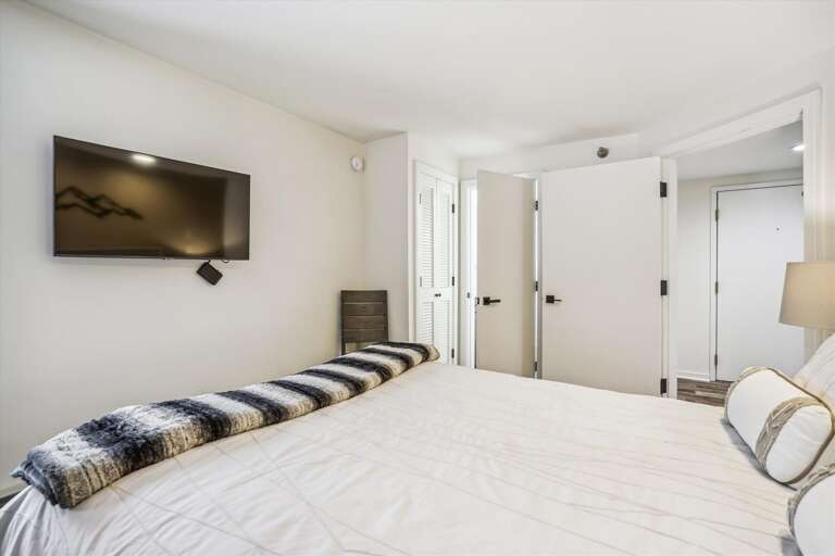 Lie in bed and watch the flat screen tv.