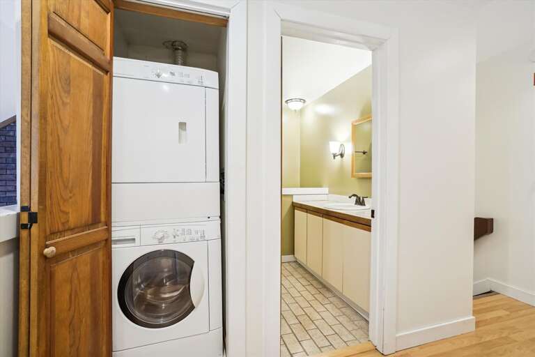 Tucked away inside is a washer and dryer for your use.