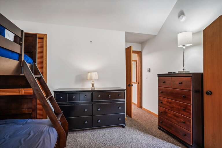 This bedroom has 2 dressers.