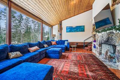 Living Room with Fireplace and Forest Views