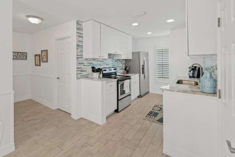 Interior Of A Kitchen With White Cabinets And Stainless Steel Appliances Interior Of A Kitchen With White Cabinets And Stainless Steel Appliances