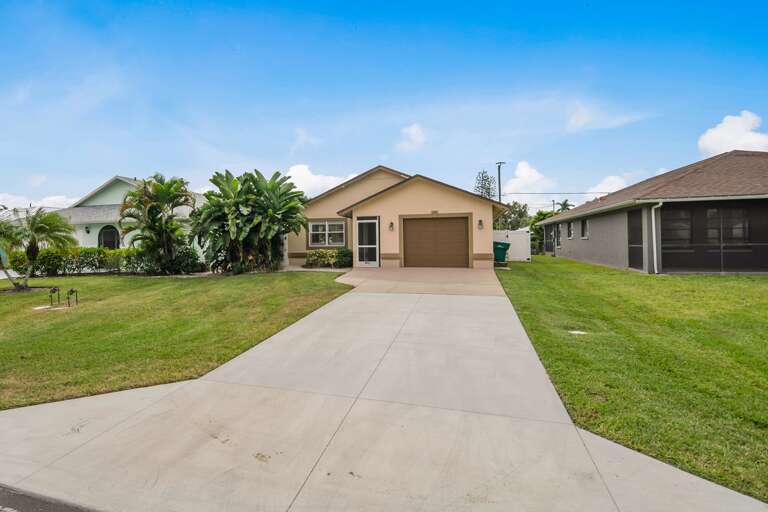 Residential Single-story House With Driveway And Lawn Residential Single-story House With Driveway And Lawn