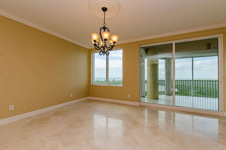 Empty Room With Chandelier And Balcony Access Empty Room With Chandelier And Balcony Access