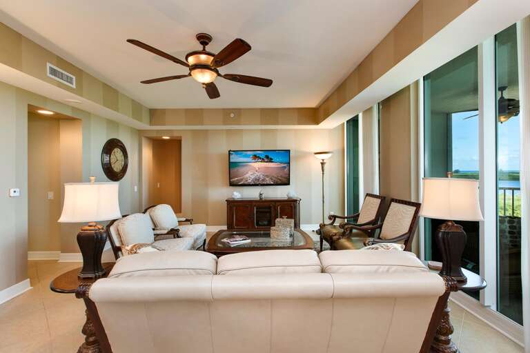 Living Room Interior With Sofas, Television, And Balcony Access