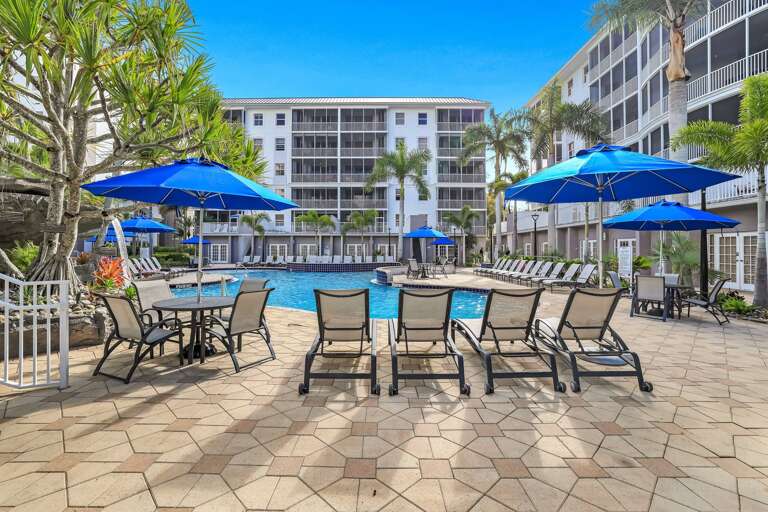 Poolside Paradise, Blue Umbrellas, Lounge Chairs, Palm Trees