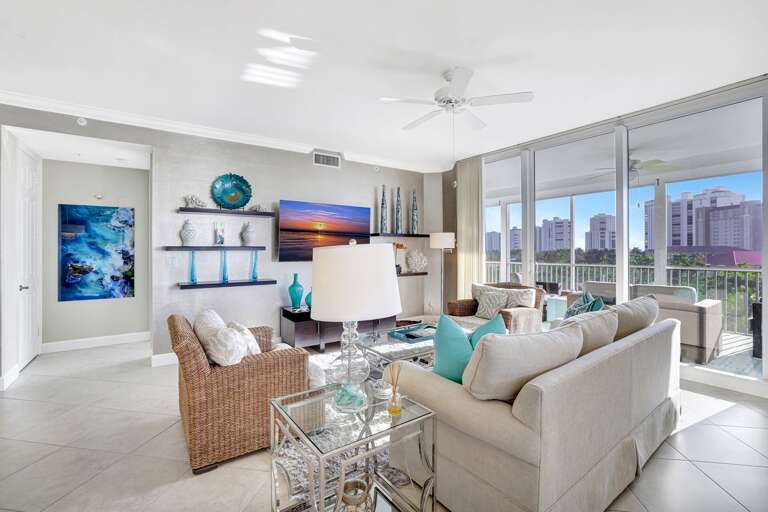 Light-filled Living Space With Large Windows And Balcony View, Styled With Soft Sofas And Serene Sea Shades