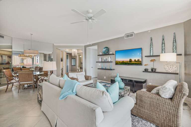 Living Room Interior With White Sofa And Mounted Television