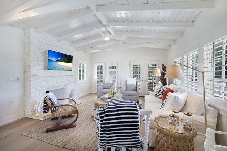 White Interior Living Space With Furniture And Television White Interior Living Space With Furniture And Television