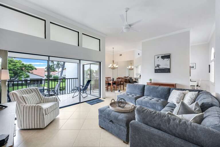 Interior Living Space With Furniture And Sliding Door Leading Outside Interior Living Space With Furniture And Sliding Door Leading Outside