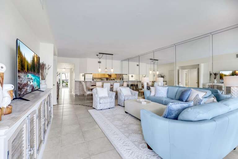 Bright Living Room Interior With Blue Sofas And Large TV Bright Living Room Interior With Blue Sofas And Large TV