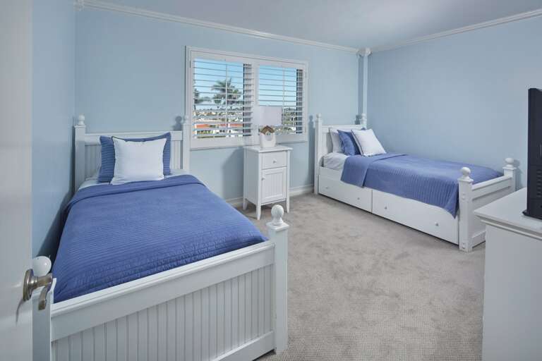 Blue Bedroom With Twin Beds In Vacation Rental, Serene Setting