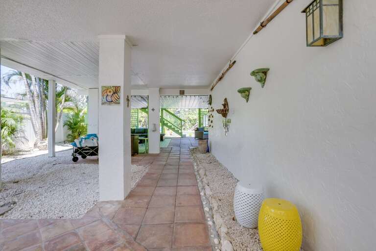 Covered Outdoor Walkway With Decorative Elements And Garden View Covered Outdoor Walkway With Decorative Elements And Garden View