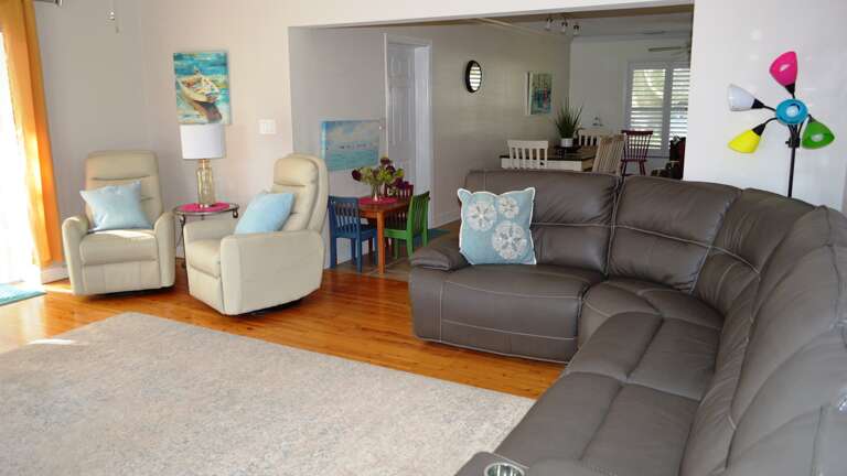 Retire to Spacious Living Room with Comfortable Seating Retire to Spacious Living Room with Comfortable Seating