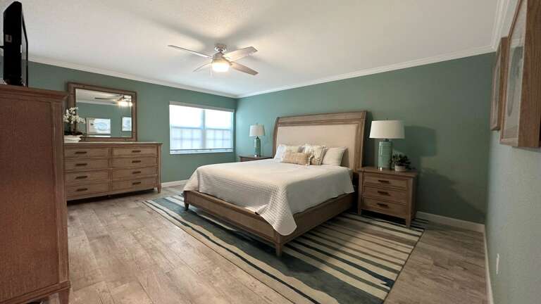 Primary Bedroom with TV and King Bed