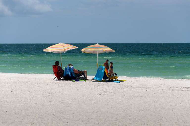 Family Time on the Silky Sand Shores of Coquina Beach