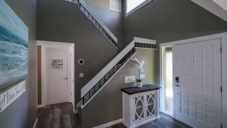Laundry Room Located Next to the Stairwell