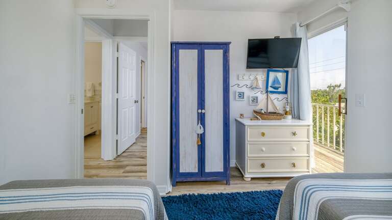 Third bedroom with TV and balcony