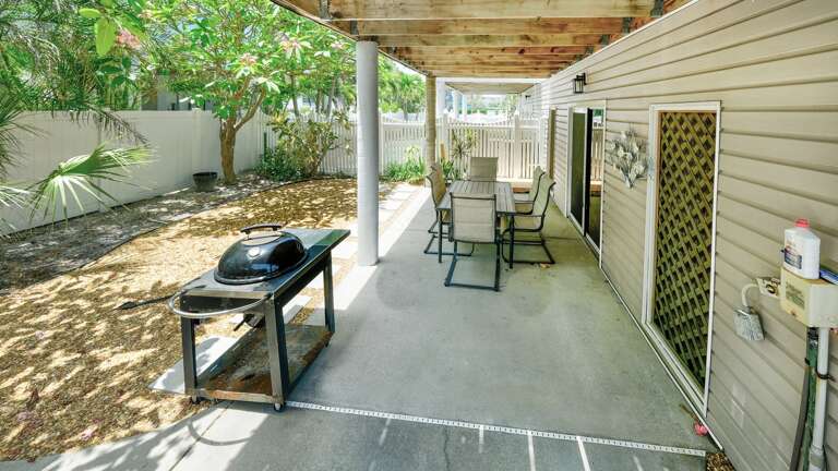 Shaded patio with grill