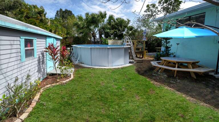 Spacious Yard with Shaded Picnic Table