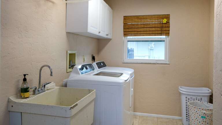 Laundry Room Located off Dining/Kitchen Area Laundry Room Located off Dining/Kitchen Area