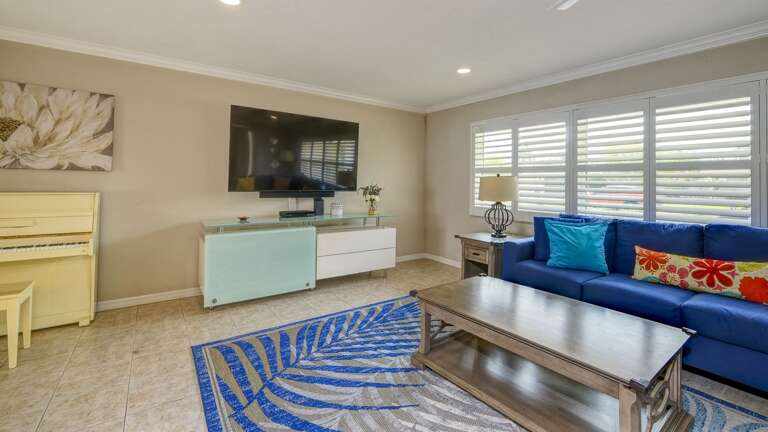 Large Mounted TV and Spacious Living Area Large Mounted TV and Spacious Living Area