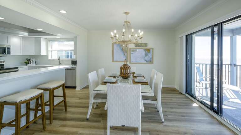 Table Seats Six plus Two More Seats at the Island Bar