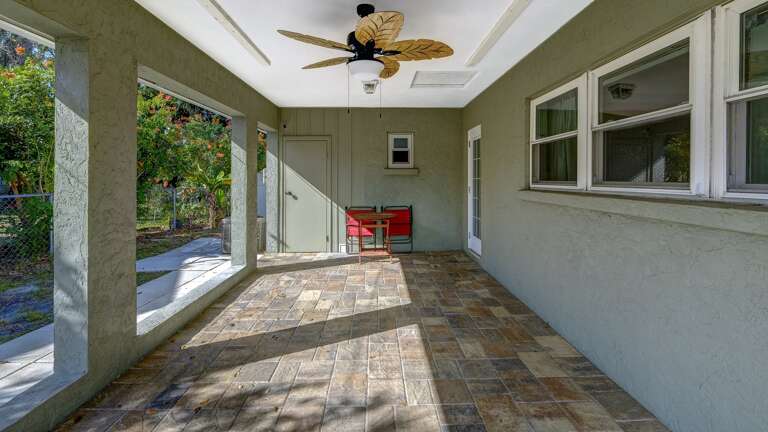 Laundry Room is Located in Carport