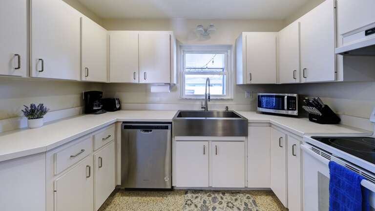 Kitchen has Updated Style and Farmhouse Sink
